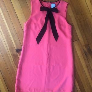 Coral with black tie dress